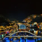 Fenghuang Ancient Town night view with bridge and river in Xiangxi, China