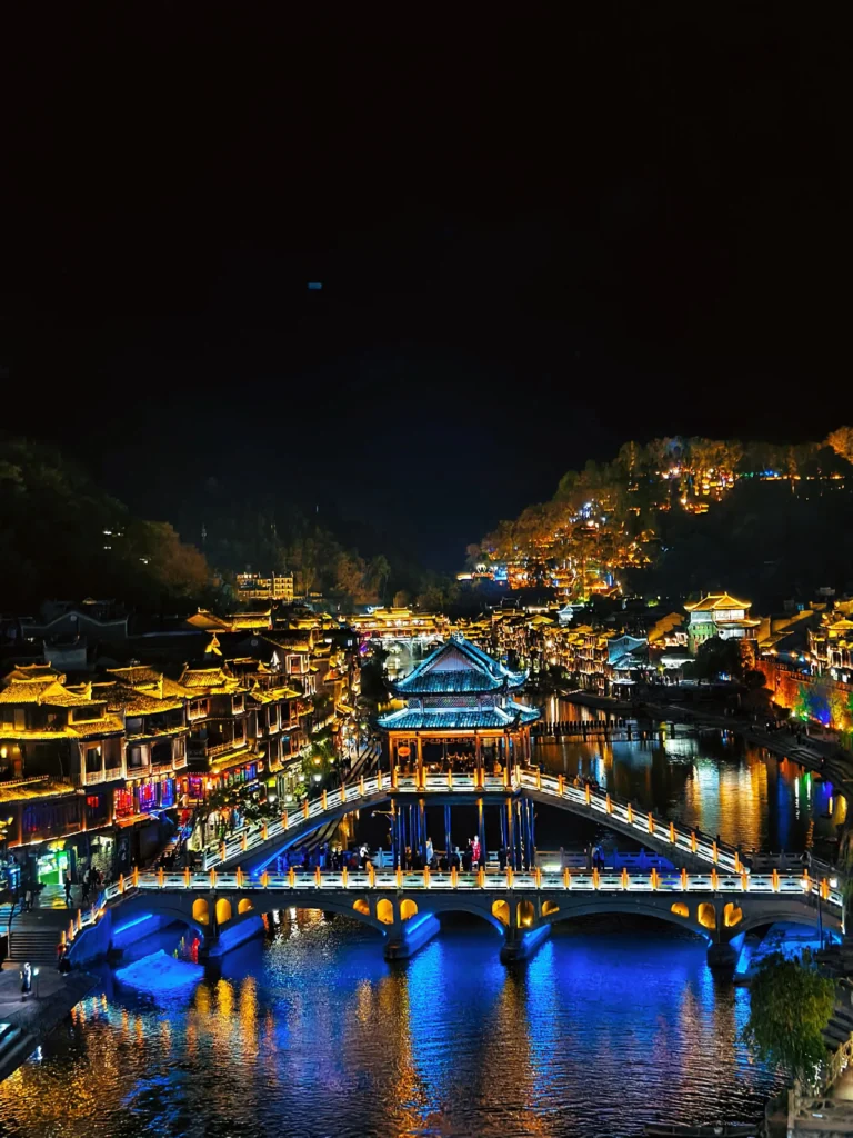 Fenghuang Ancient Town night view with bridge and river in Xiangxi, China
