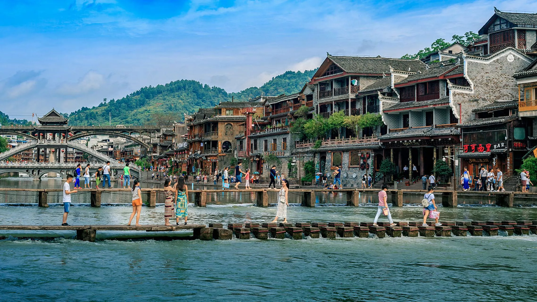 Daytime riverside walk along the Tuojiang River in Fenghuang Ancient Town