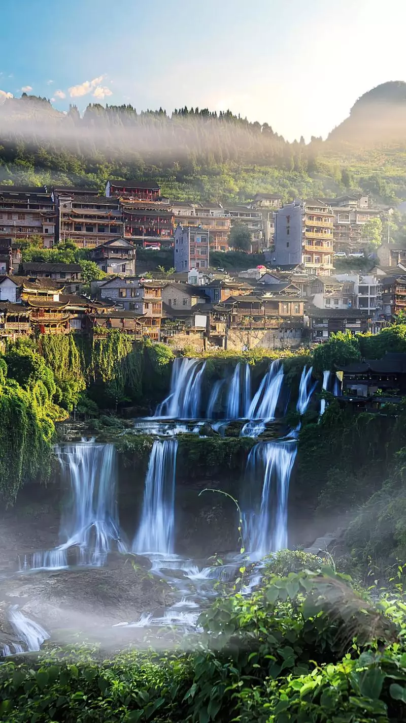 Furong Town waterfall and ancient riverside buildings for Muslim travel planning