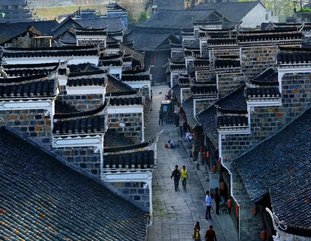 Liye Ancient City old town roofscape with traditional grey tiles, stone walls and narrow walking streets.