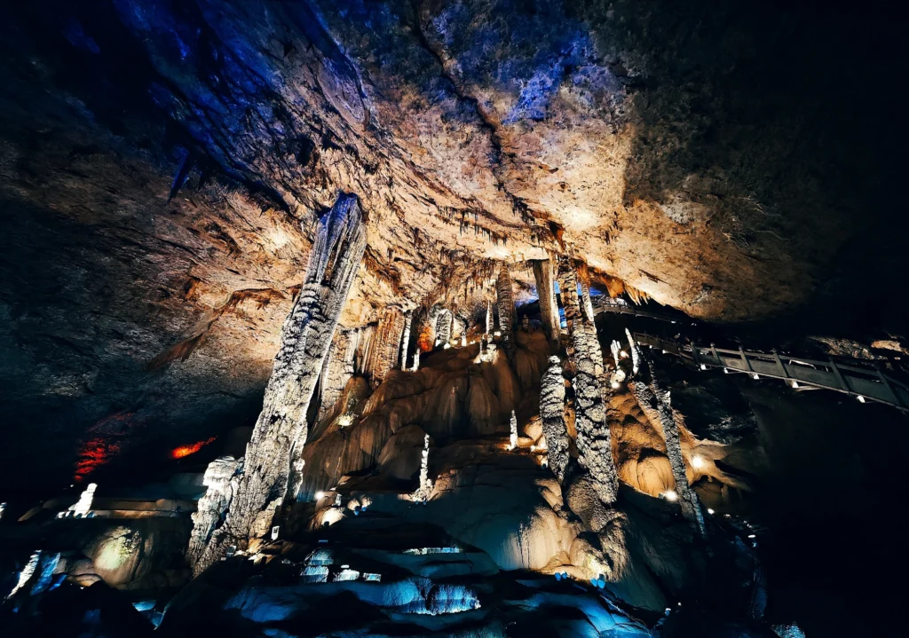 Zhangjiajie Jiutian Cave large karst hall with illuminated stalagmites and cave formations