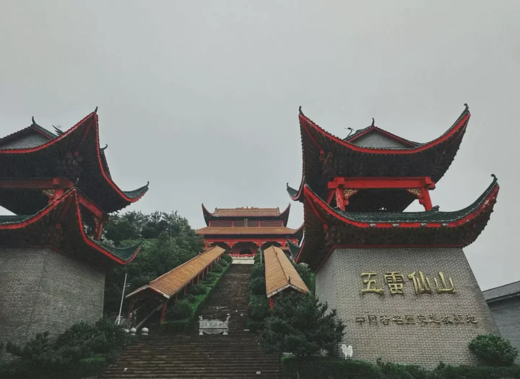 Zhangjiajie Wulei Mountain temple and bridge under a bright blue sky