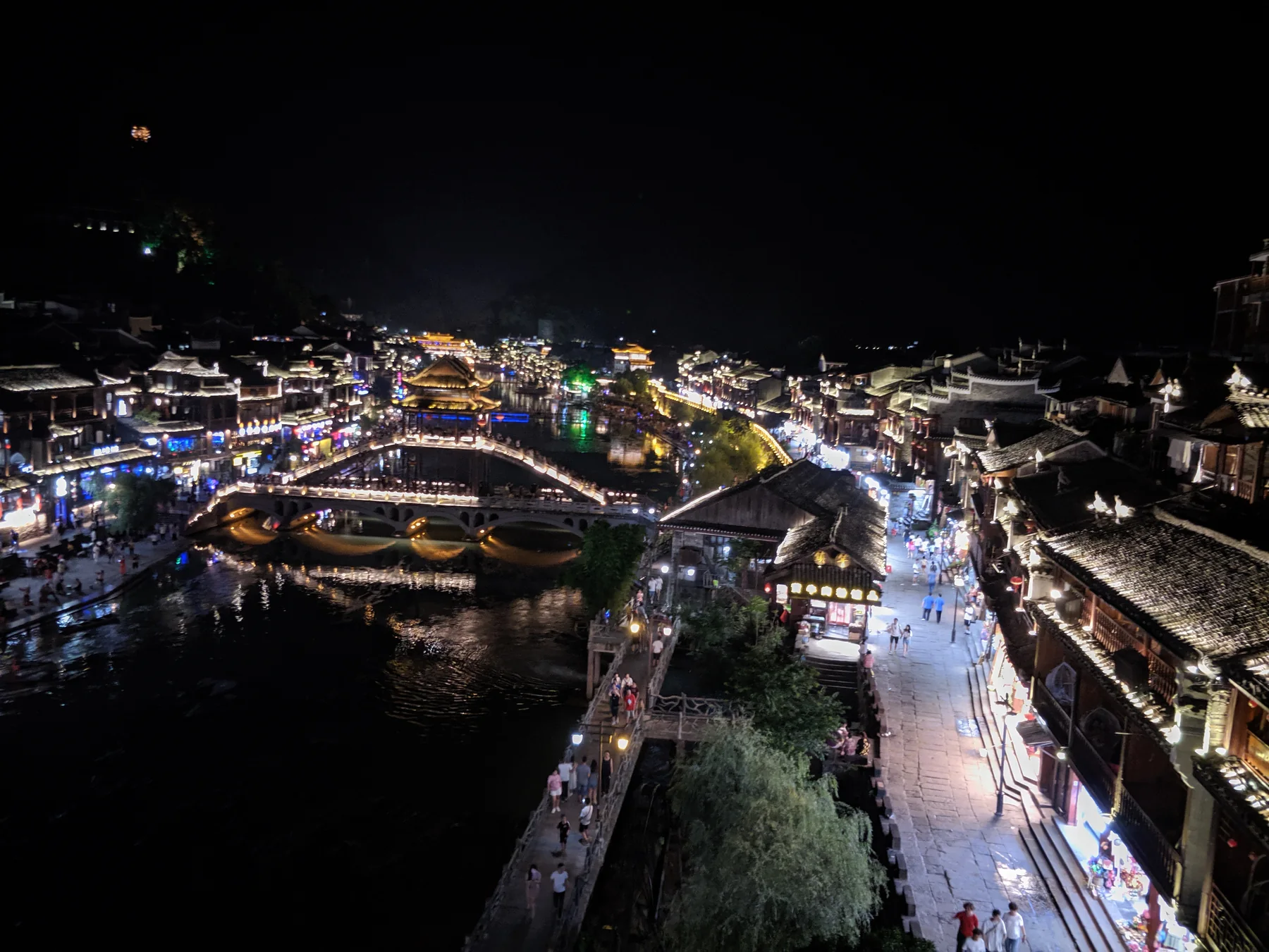 fenghuang ancient town and furong ancient town comparison showing Fenghuang night stay scenery