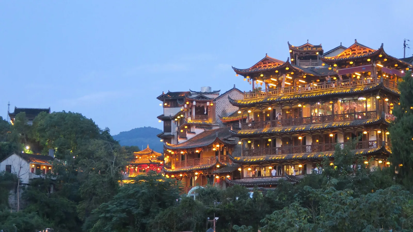 Furong Ancient Town hotel and luggage planning near old-town night scenery