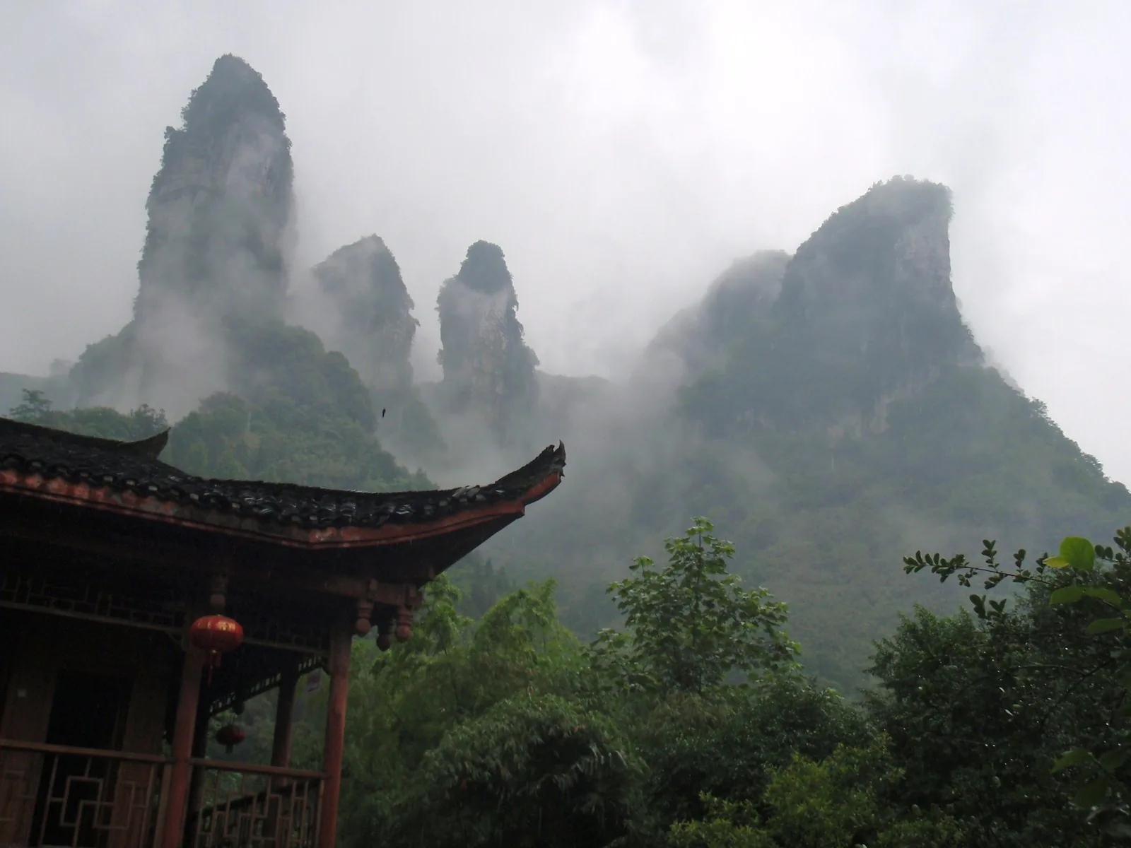 aizhai bridge nearby Dehang mountain scenery with misty canyon peaks
