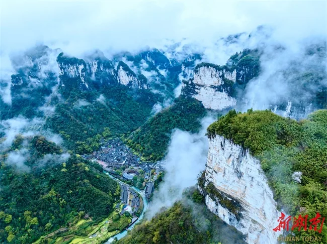 aizhai bridge route context with Xiangxi mountain village scenery beyond Zhangjiajie