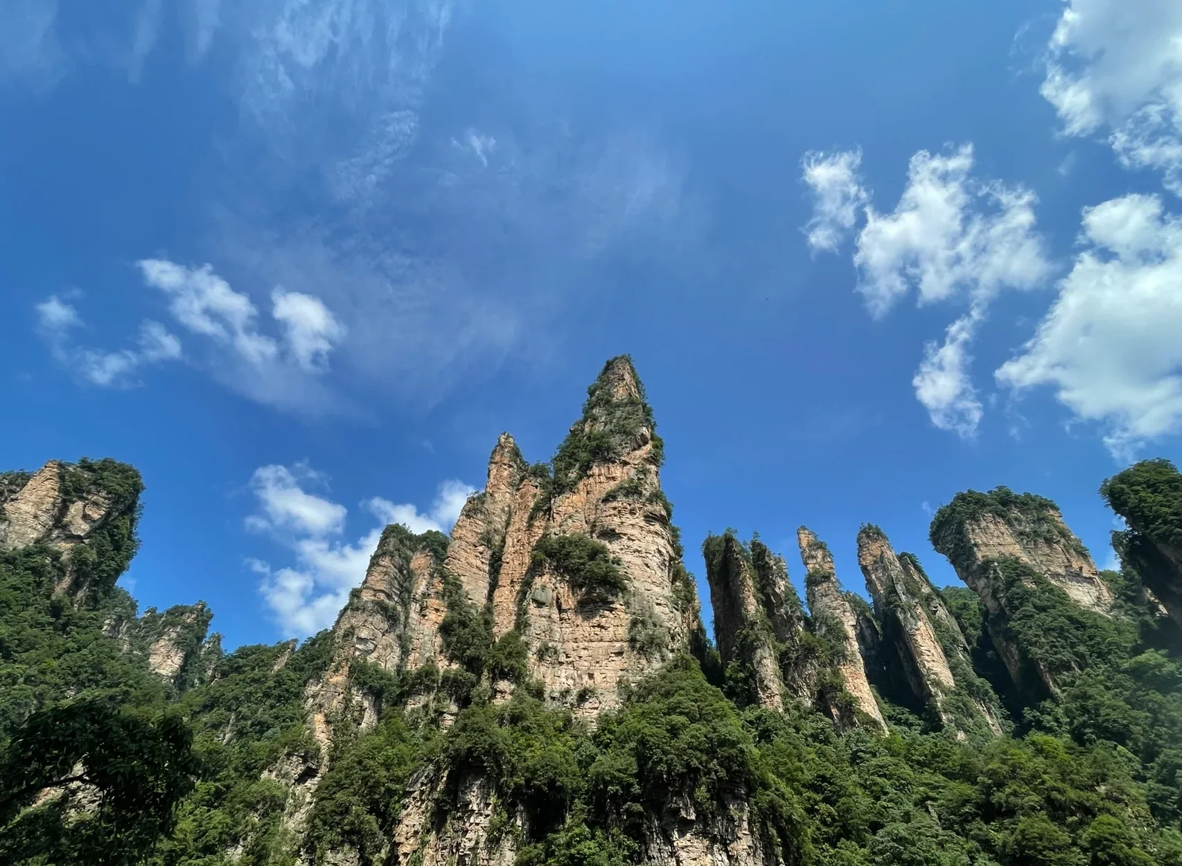 tianzi mountain sandstone peaks under a bright blue sky in Zhangjiajie National Forest Park