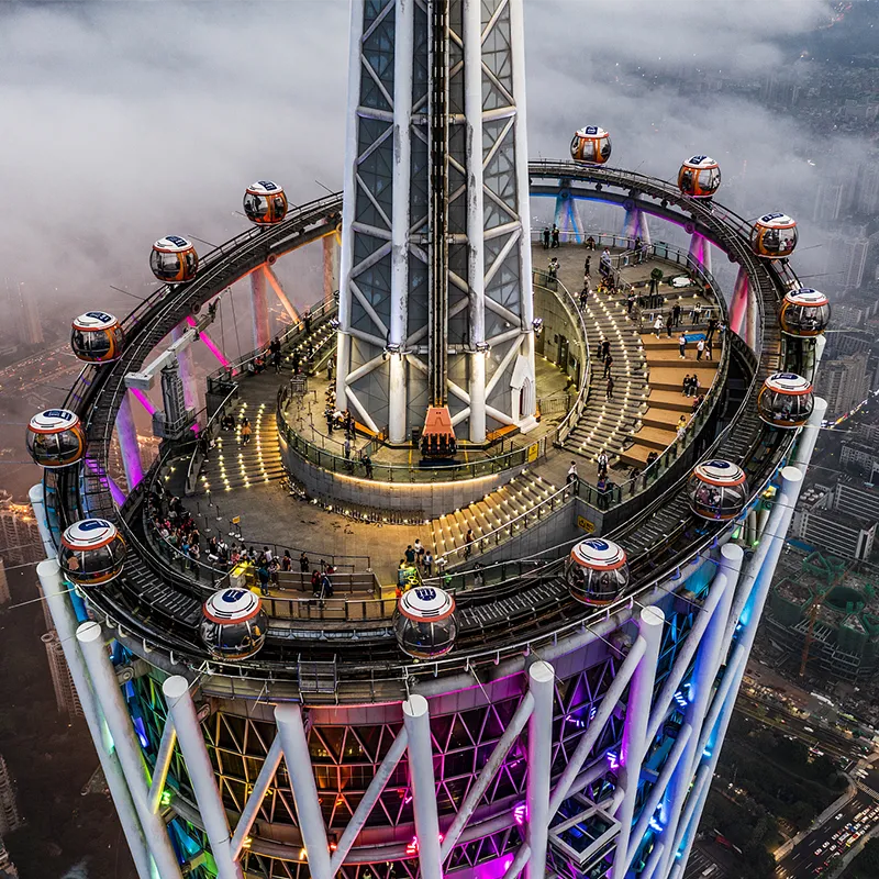 Canton Tower lit up at night over the Pearl River in Guangzhou