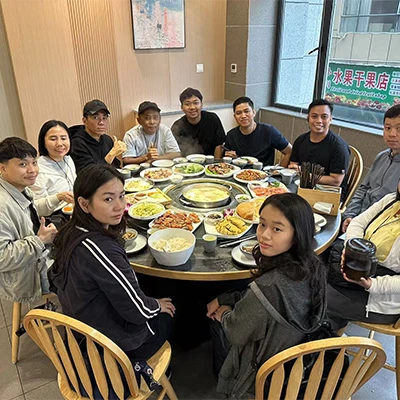 Fatimah and family sharing a meal during their China trip