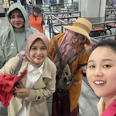 Amina binti Ahmad and companions taking a selfie during their China trip