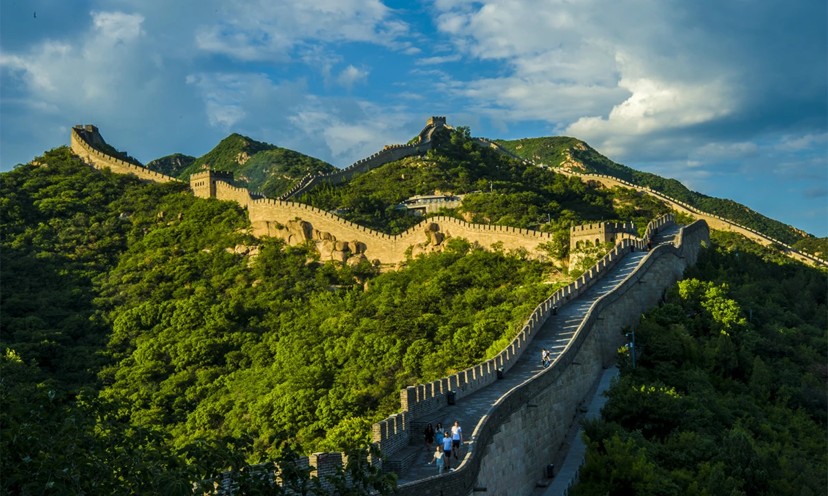 Great Wall of China winding across green mountains near Beijing