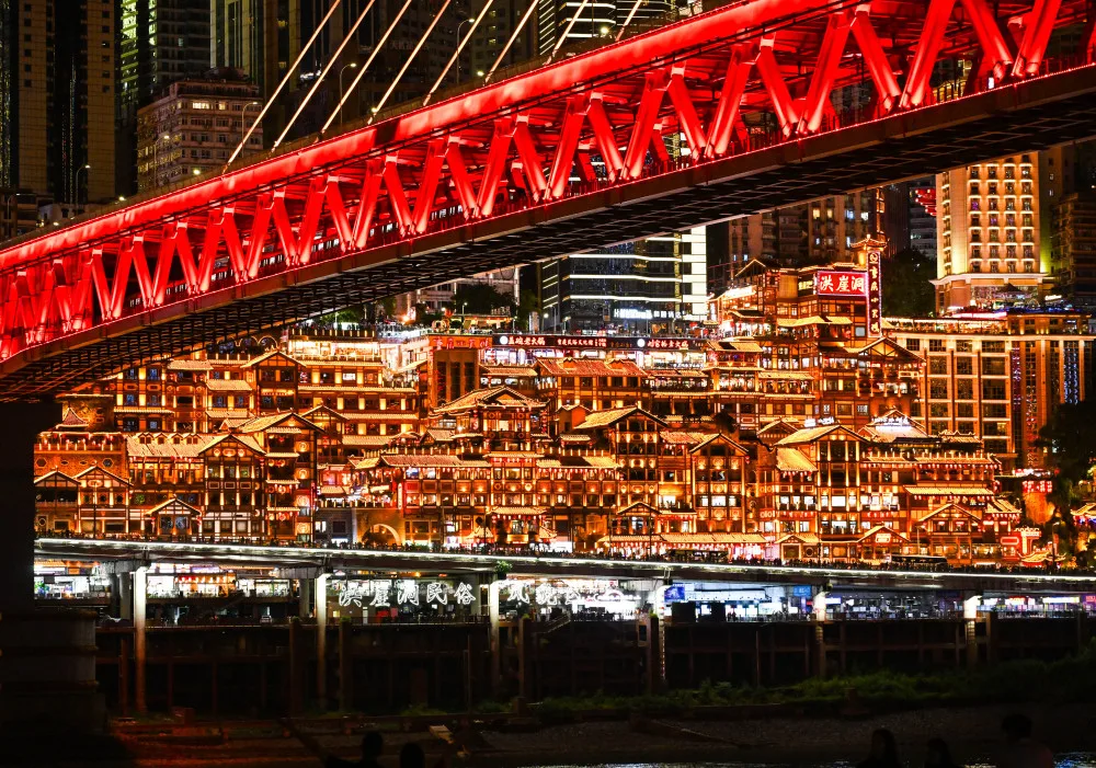Hongyadong stilted houses and Qiansimen Bridge lit up at night in Chongqing