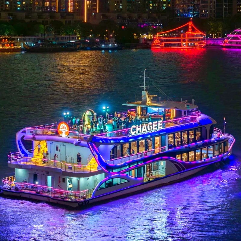 Evening Huangpu River cruise with illuminated Shanghai skyline