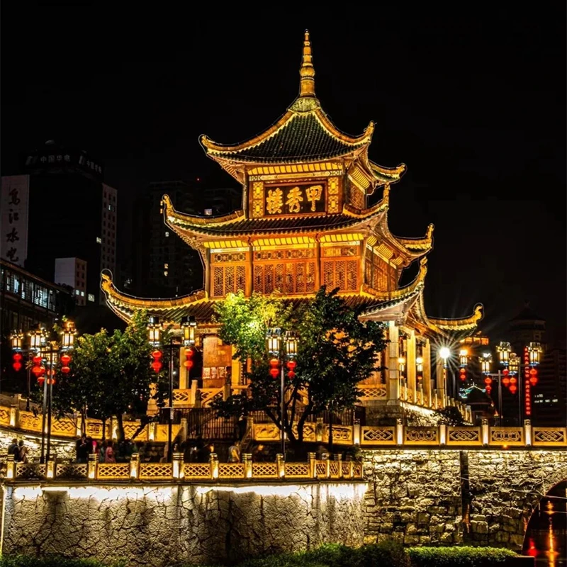 Jiaxiu Tower lit up over the Nanming River in central Guiyang
