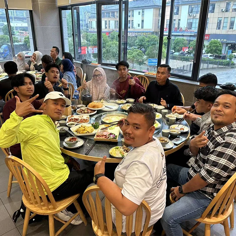 Muslim tour group sharing a halal dinner at a restaurant in China