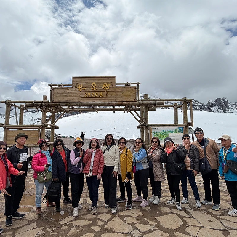 Muslim group tour at a high mountain pass on the Yunnan route from Kunming