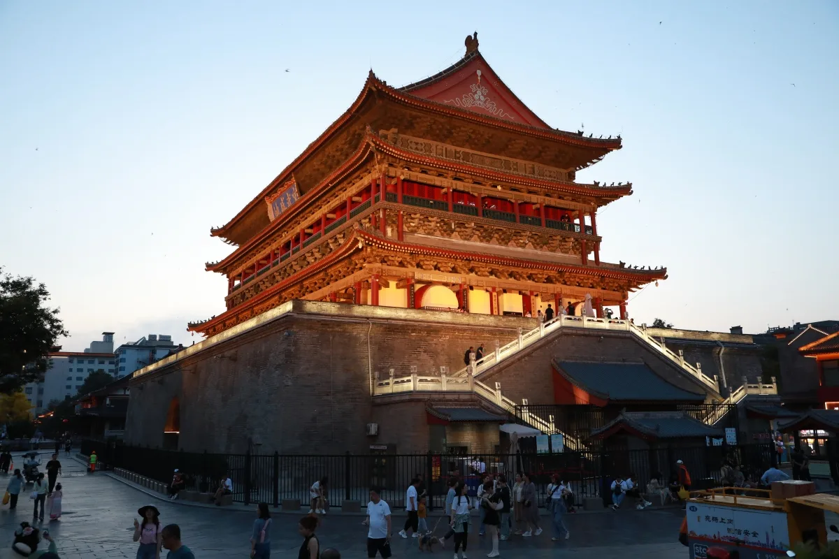 Xi'an Drum Tower lit up at dusk, marking the entrance to the Muslim Quarter