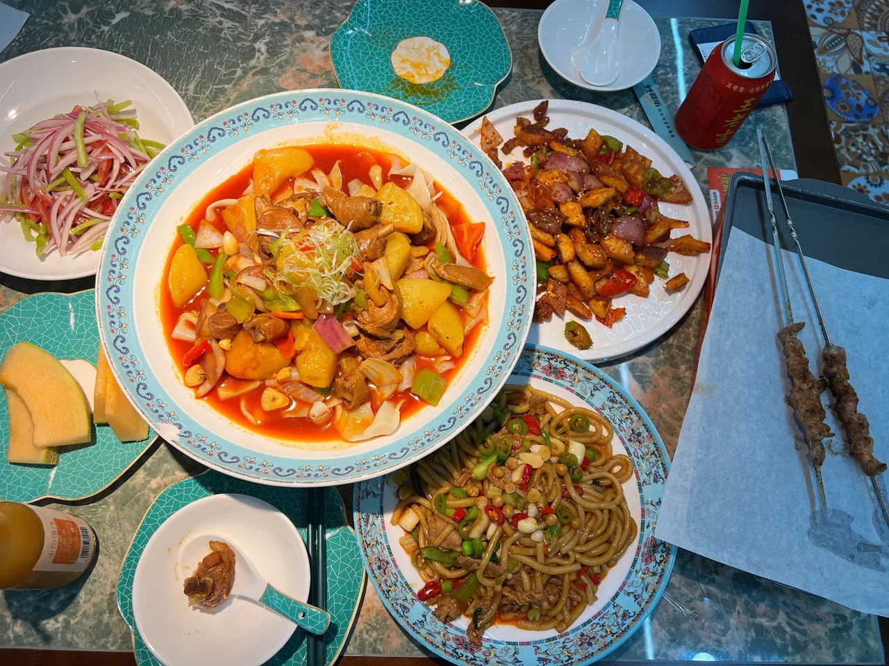 Xinjiang halal food in Shanghai — big-plate chicken, fried noodles and lamb skewers