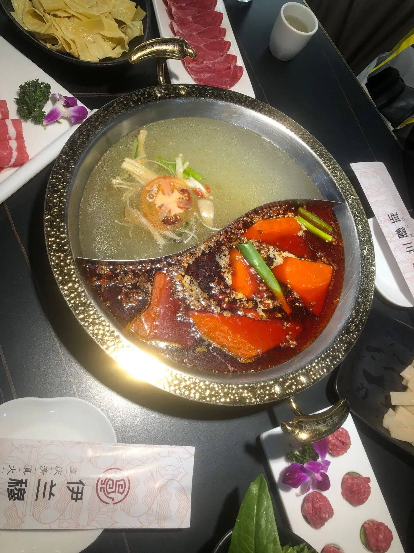 Two-broth halal hotpot with mild and spicy soup bases at a halal hotpot restaurant in Chongqing