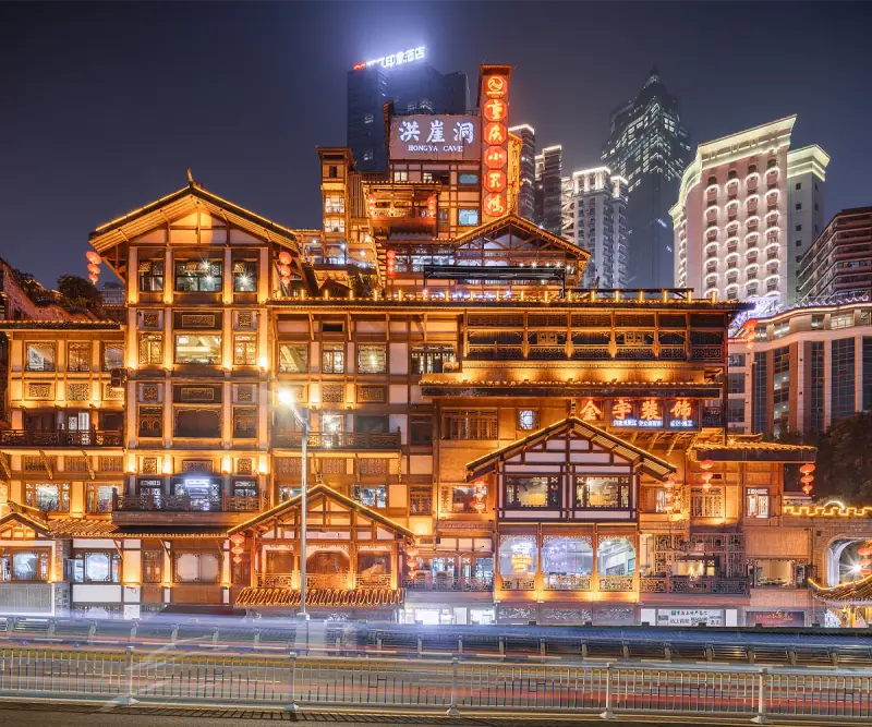 Illuminated traditional-style buildings in Chongqing at night