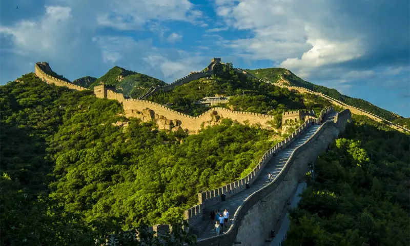 Great Wall of China winding across green mountains near Beijing
