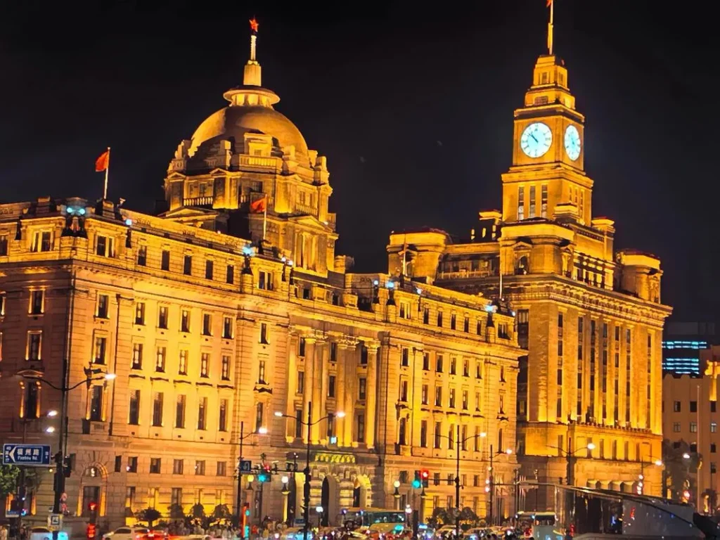Historic Bund buildings lit up at night in Shanghai, the Day 1 evening stop of this Muslim itinerary