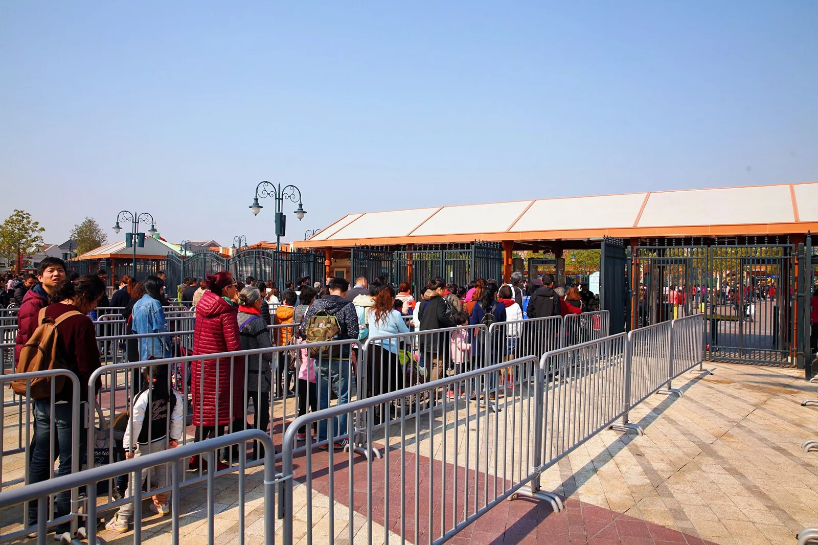Visitors queuing at the Shanghai Disneyland entrance security and bag check