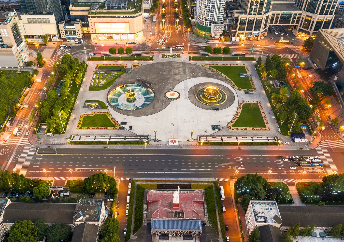 Aerial view of Tianfu Square in central Chengdu at dusk — the halal cluster and Huangcheng Mosque sit a short walk west of here