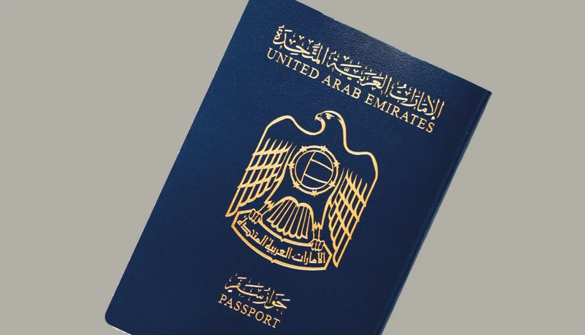 United Arab Emirates passport cover with gold eagle emblem on navy blue background
